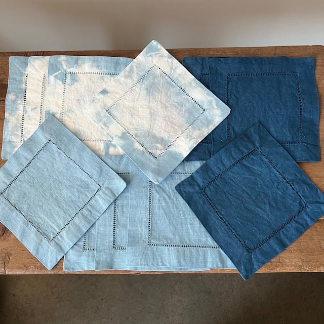 Indigo cocktail napkins with a leaf pattern, made from seed fabric, showcasing the decorative design from the Hudson Valley Seed Company.