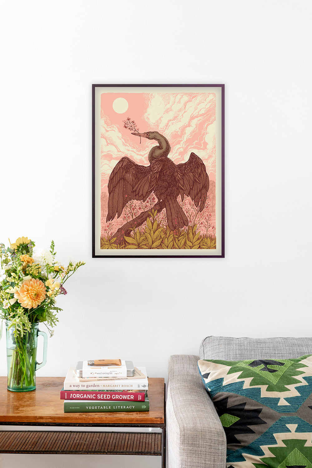 Signed Jewels of Opar art print by Hudson Valley Seed Co. displayed in a room, showcasing vibrant colors and intricate details.