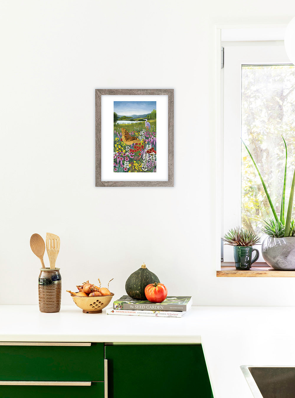Northeast Native Wildflower art print by Hudson Valley Seed Co. displayed in a room, showcasing detailed native flower illustrations.