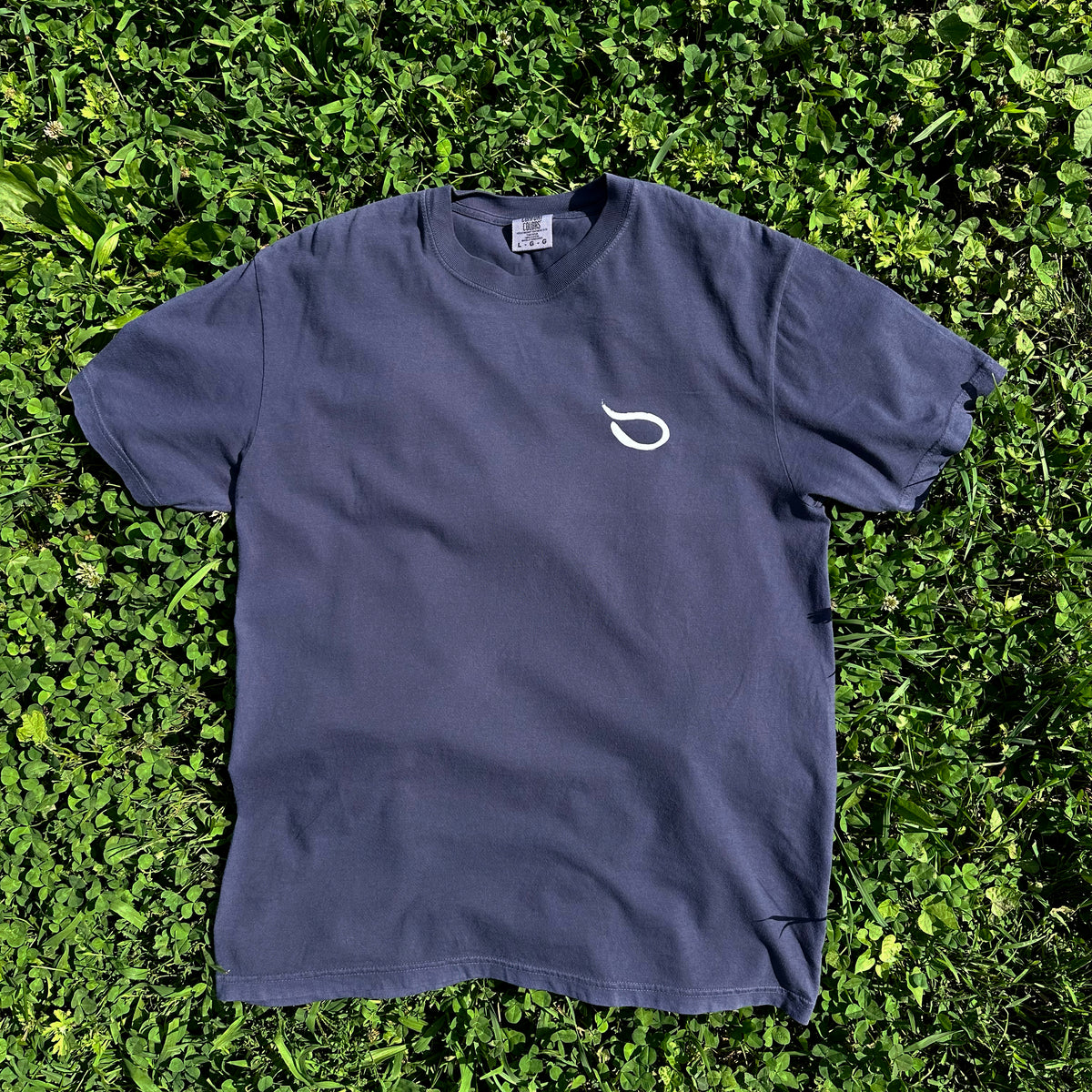 Navy Hudson Valley Seed Co logo T-shirt featuring a simple design, made from soft fabric, displayed flat on a white background.
