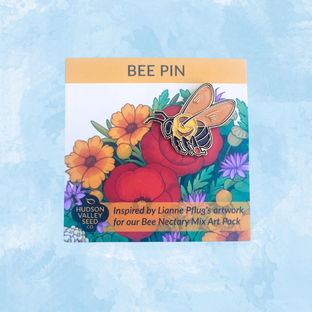 Bee Nectary bee enamel pin from Hudson Valley Seed Co. displayed with artwork card featuring a detailed bee design.