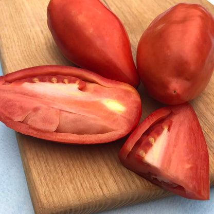 Blue Beech tomato from Hudson Valley Seed Co., vibrant blue heirloom vegetable with smooth skin and round shape.