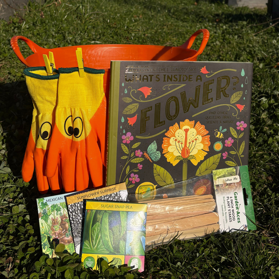 Young gardeners starter kit by Hudson Valley Seed Company with seed packets, gardening tools, and educational materials for kids.