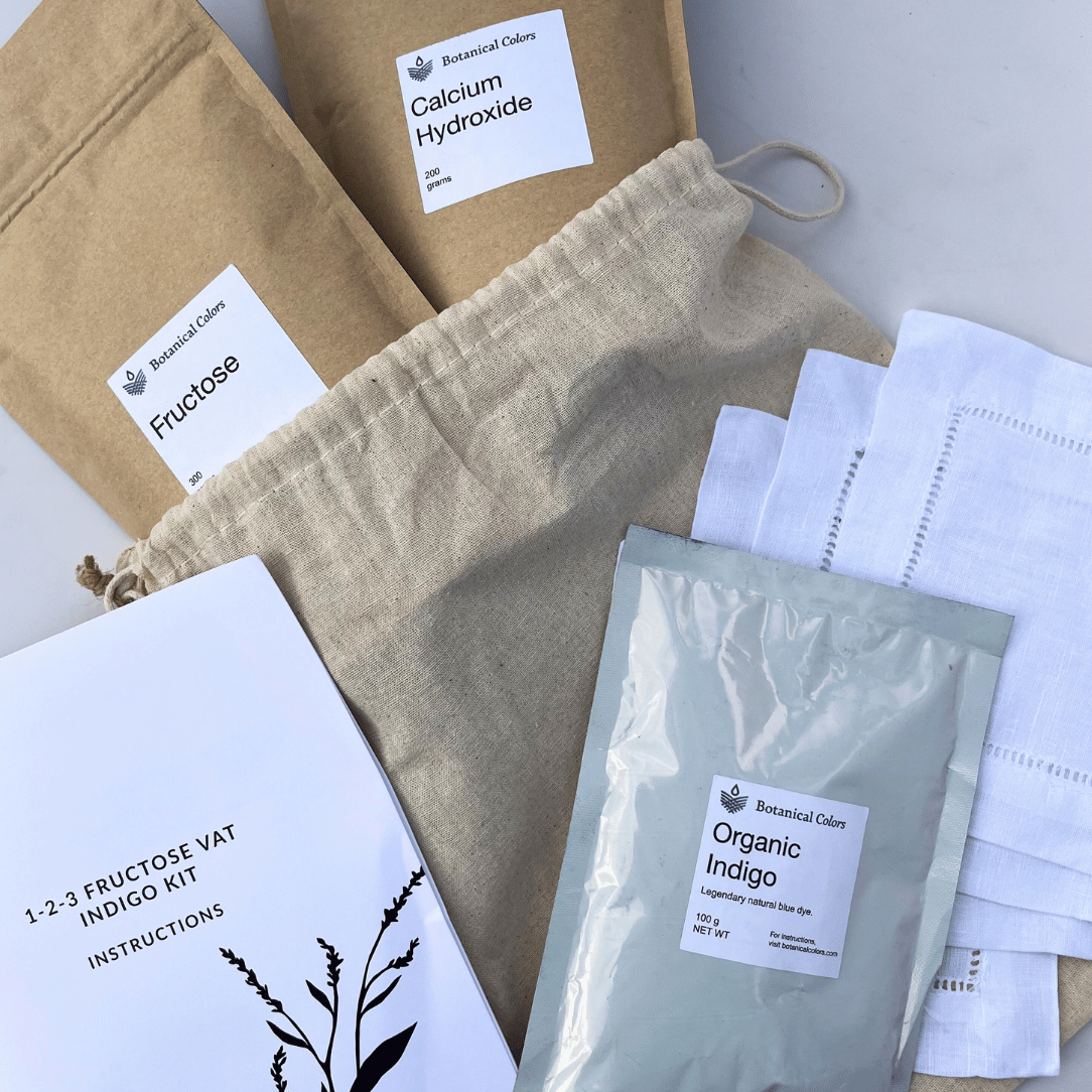 Botanical Colors 1-2-3 Indigo Dye Kit for fabric dyeing, featuring natural indigo powders and dyeing tools on a white background.