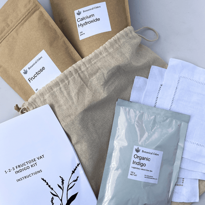 Botanical Colors 1-2-3 Indigo Dye Kit for fabric dyeing, featuring natural indigo powders and dyeing tools on a white background.
