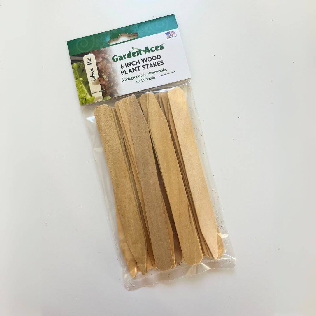 Six-inch wooden plant labels for gardening, featuring natural wood finish and engraved writing surfaces, ideal for garden tools and supplies.