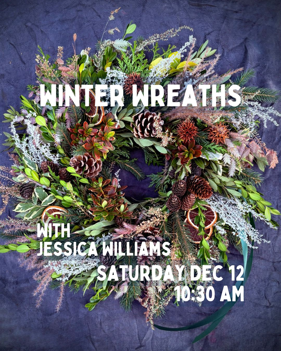 Decorative winter wreath featuring festive greenery and ornaments, displayed at a Jessica Williams event.