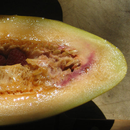 Fresh Banana Melon vegetable from Hudson Valley Seed Co., showing its yellow-green exterior and ripe interior.