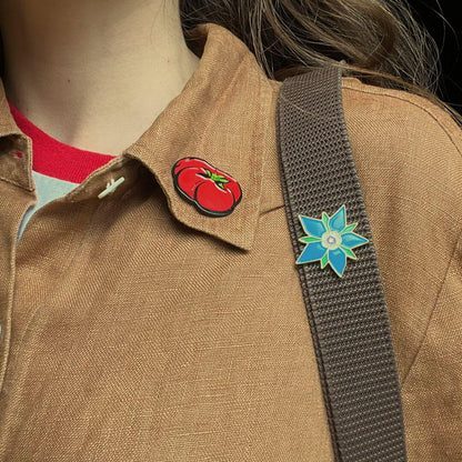 Borage enamel pin from Hudson Valley Seed Co. featuring a detailed design of borage flowers and tomatoes.