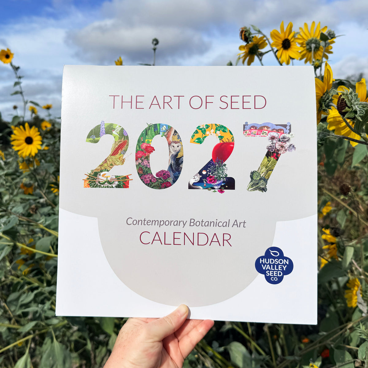 2027 Art of Seed Calendar by Hudson Valley Seed Co. featuring botanical illustrations on a decorative wall calendar.