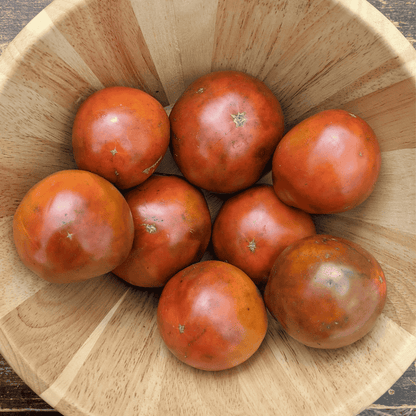 Japanese Black Trifele tomato from Hudson Valley Seed Co. featuring dark, elongated heirloom vegetables with smooth skin and rich color.