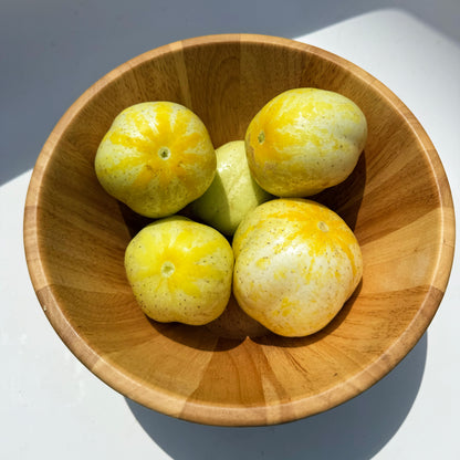 Fresh lemon cucumbers from Hudson Valley Seed Co., vibrant yellow-green vegetables with smooth skin and crisp texture.
