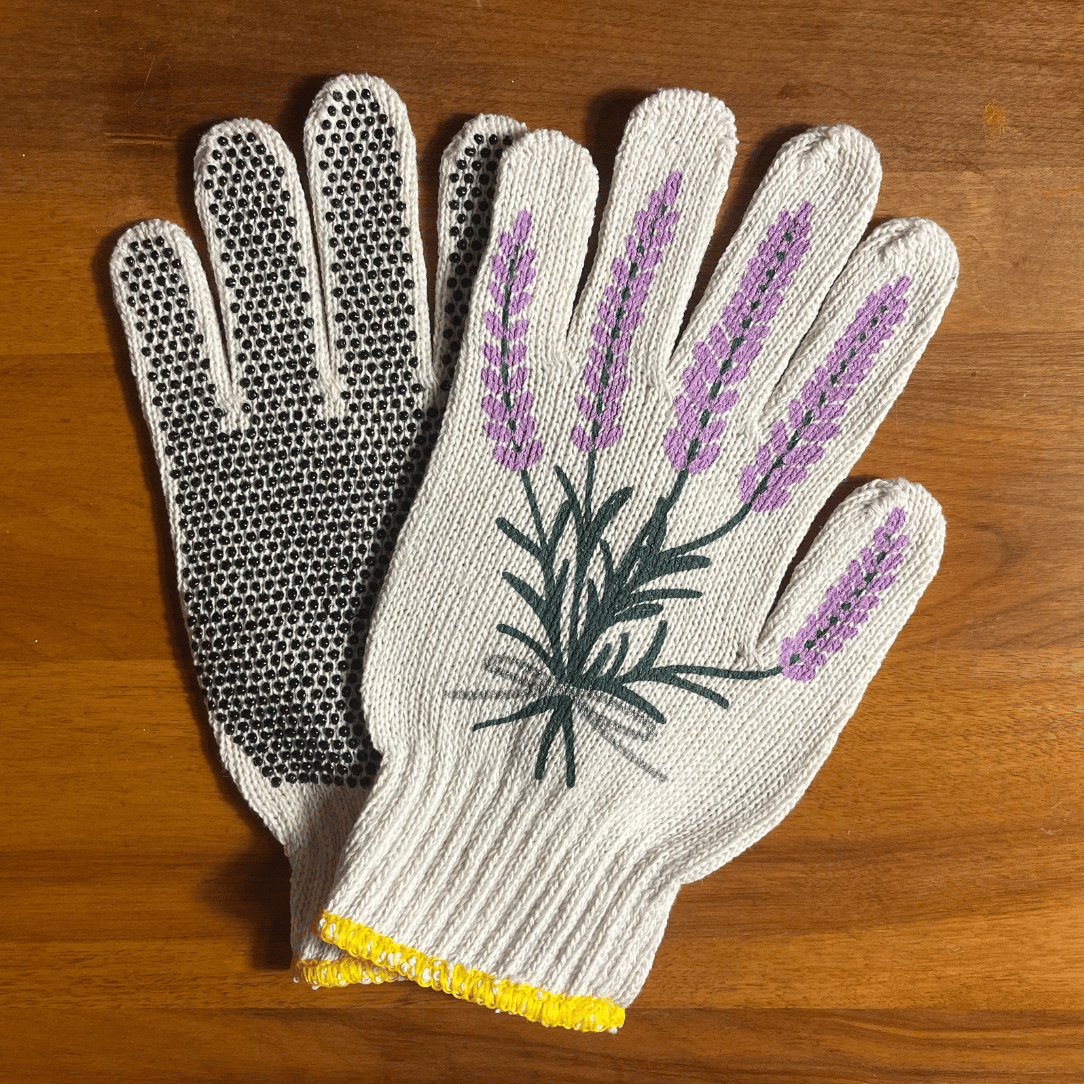 Pair of printed garden gloves by My Little Belleville with colorful floral patterns, suitable for gardening tasks.