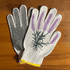 Pair of printed garden gloves by My Little Belleville with colorful floral patterns, suitable for gardening tasks.
