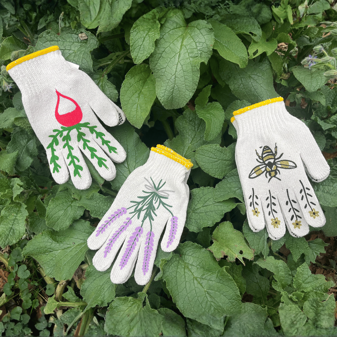 Pair of printed garden gloves from My Little Belleville with colorful floral designs, ideal for gardening and outdoor work.