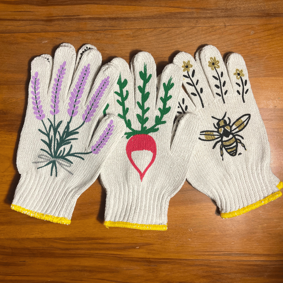 Pair of printed garden gloves from My Little Belleville with floral patterns, designed for gardening tools and supplies.