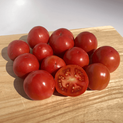 Plate of Haiti tomato vegetables by Hudson Valley Seed Co., showcasing fresh, ripe tomatoes on a plate.