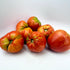Fresh Upstate Oxheart Tomato, a large, heart-shaped vegetable from Hudson Valley Seed Co., showcasing vibrant red color and ripe texture.