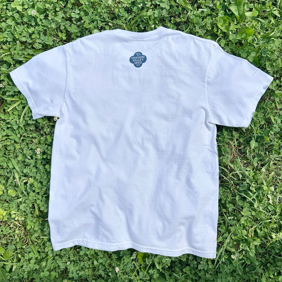 White Hudson Valley Seed Co logo t-shirt, casual cotton apparel with printed brand logo on front, ideal for gift or everyday wear.