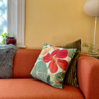 Hudson Valley Seed Co. Glorious Gleam Nasturtium throw pillow with vibrant floral design on soft fabric.
