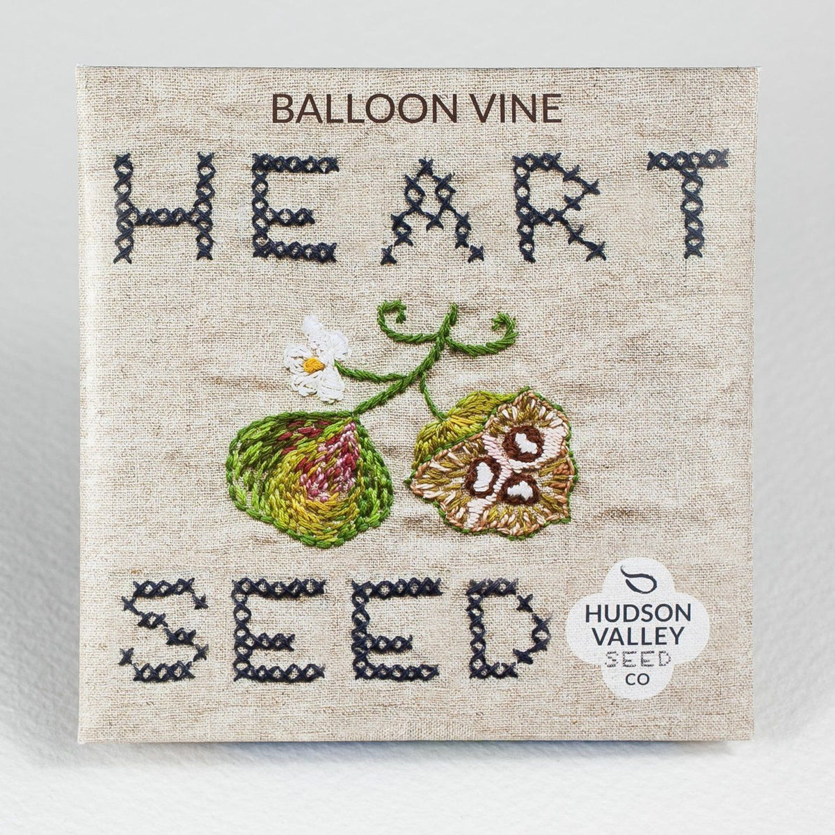 Bright Balloon Vine flowers from Hudson Valley Seed Co., showcasing delicate, colorful blossoms on a lush green vine.