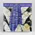 Blue Jade Dwarf Sweet Corn from Hudson Valley Seed Co., fresh blue jade-colored corn cobs with green husks and silk.