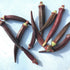 Fresh Burgundy okra vegetables from Hudson Valley Seed Co., showcasing their vibrant color and plump, tender pods.