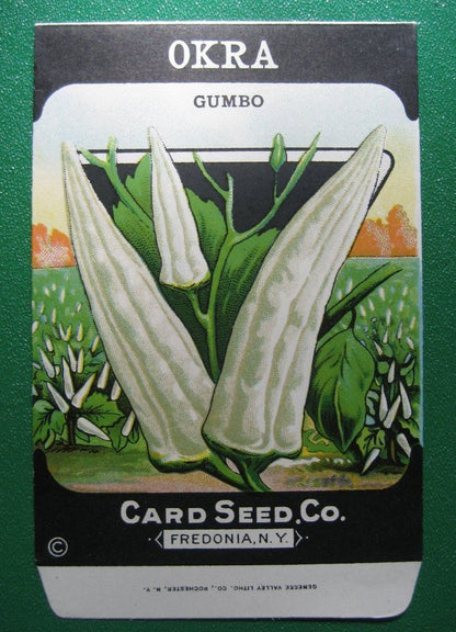 Fresh Clemson Spineless Okra vegetables from Hudson Valley Seed Co., shown in a vendor display.