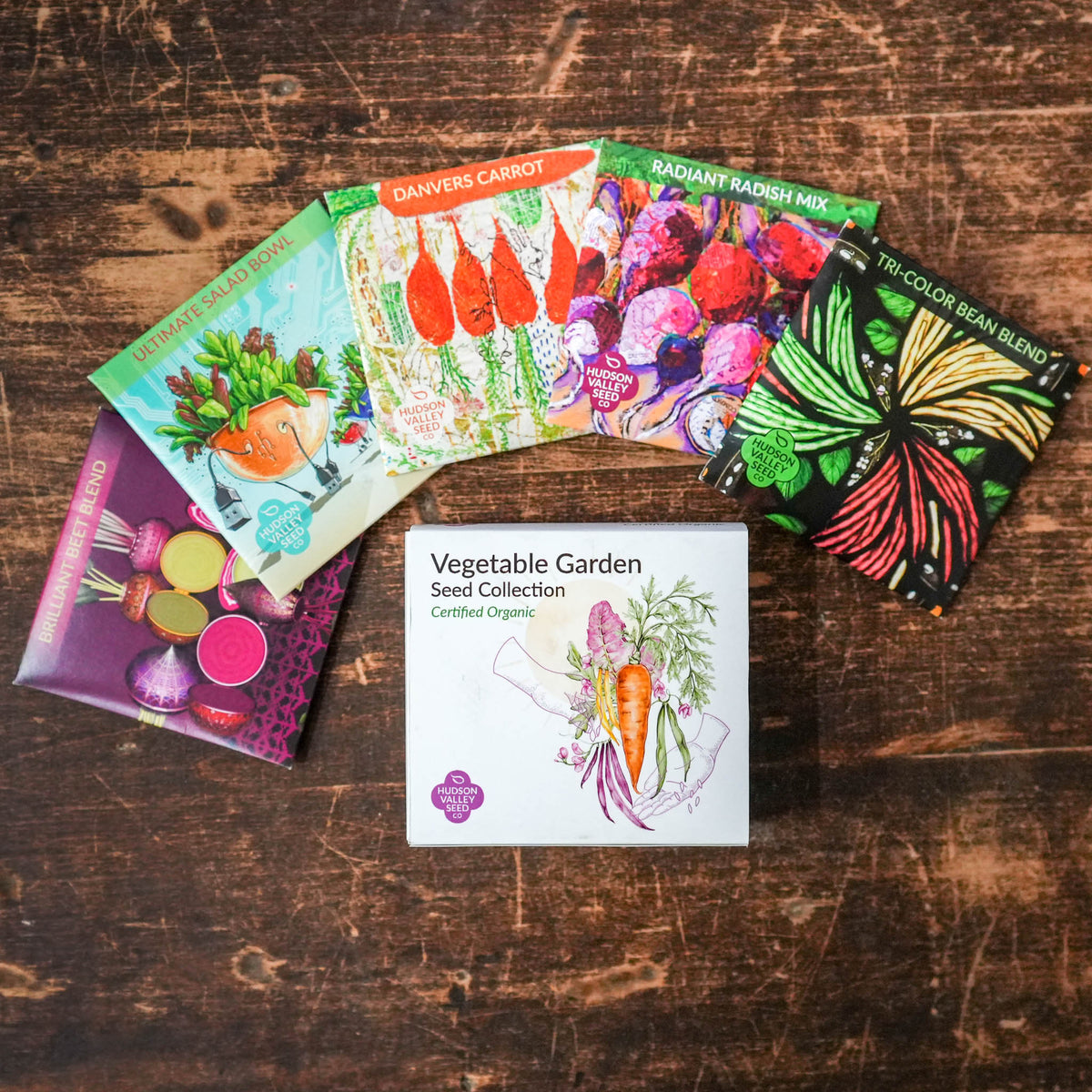 Vegetable garden seed collection from Hudson Valley Seed Co., featuring various vegetable seeds in colorful packaging.