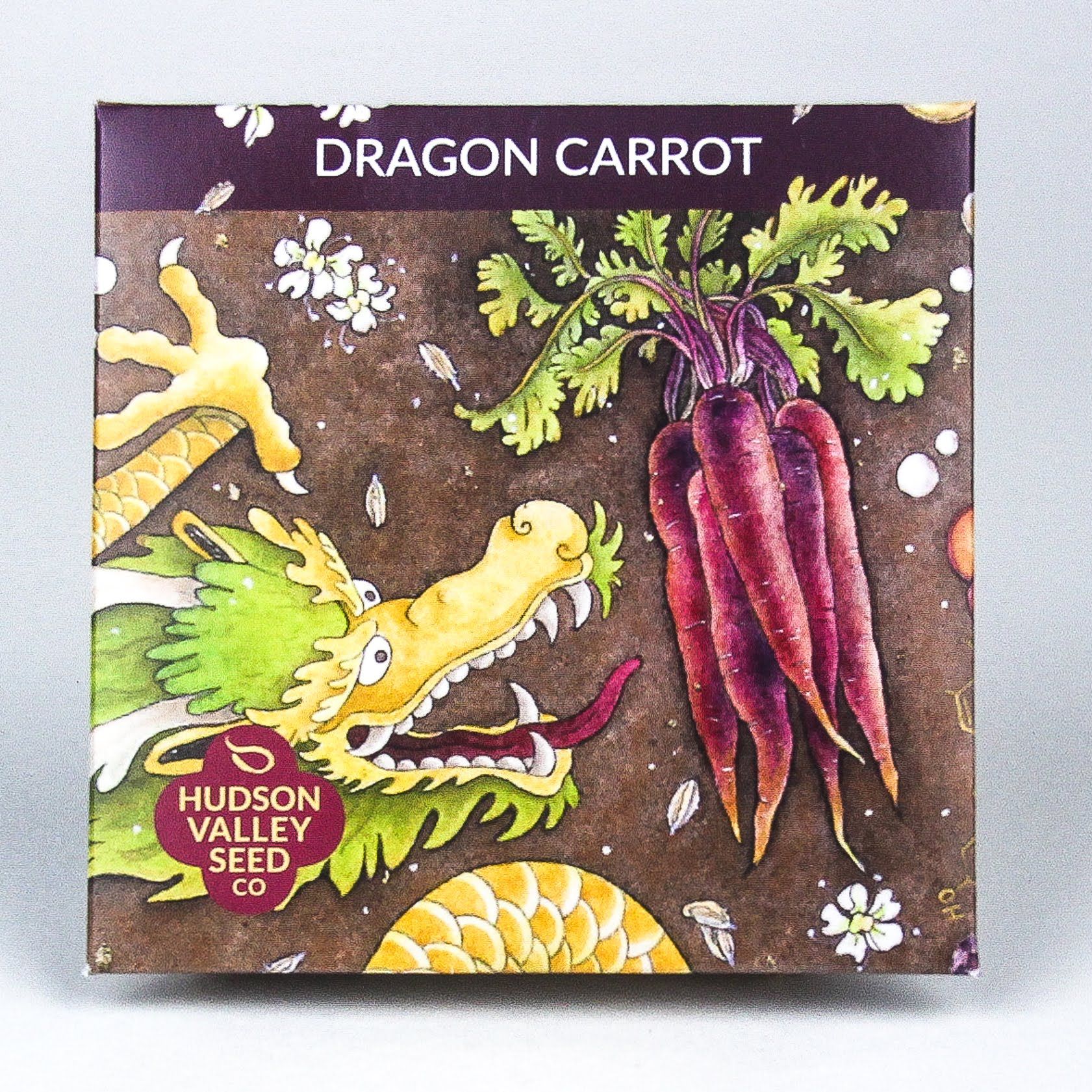 Fresh dragon carrots from Hudson Valley Seed Co., showcasing vibrant orange and purple striped vegetables on display.
