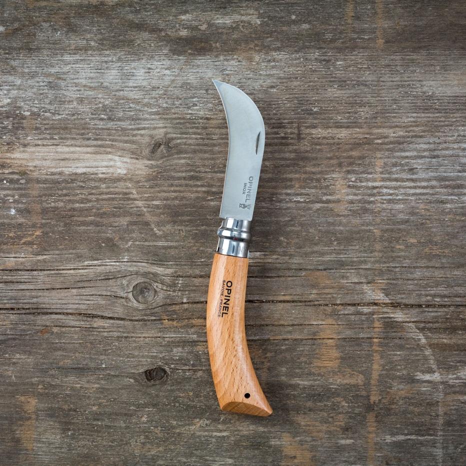 Opinel folding harvest knife with wooden handle and stainless steel blade, ideal for gardening and harvesting tasks.
