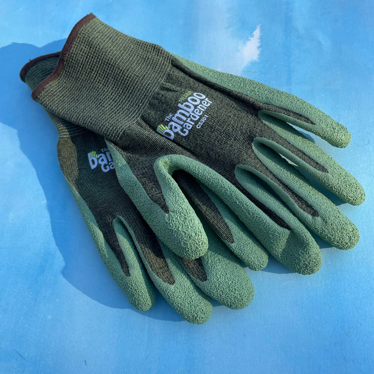 Bamboo Rayon and natural rubber palm gardening gloves by The Bamboo Gardener, showing the gloves with green fabric and rubber palms.