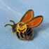 Enamel pin featuring a bee design from Hudson Valley Seed Co., perfect for gift shop accessories.