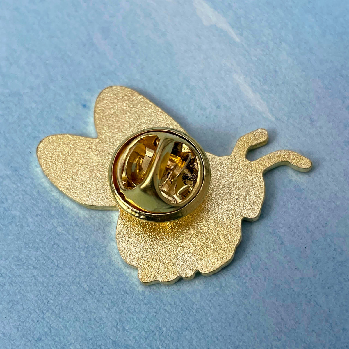 Bee Nectary bee enamel pin from Hudson Valley Seed Co., featuring a detailed bee design on a metal pin.