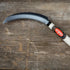 Large Kusakichi saw tooth sickle with sharp curved blade, ideal for gardening and agricultural use.