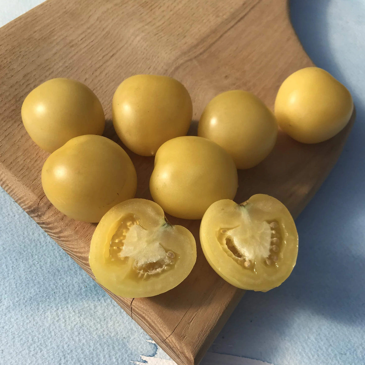 Fresh Mandurang Moon Tomato from Hudson Valley Seed Co., showcasing vibrant, ripe vegetables on display at a vendor stall.